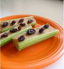 Ants on a long, celery filled with peanut butter topped with raisins